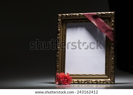 Blank mourning frame for condolence card on dark background