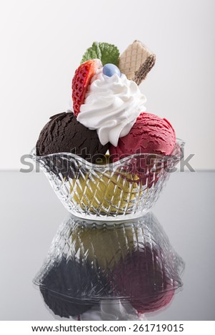 simple restaurant sundae, with whipped cream, and strawberry