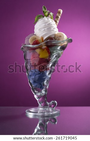 colorful mixed fruit cup with whipped cream decorated