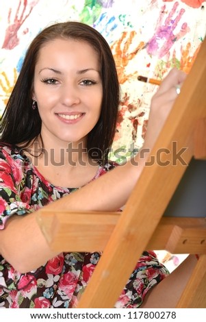 Beautiful woman painting