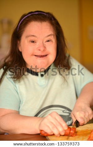 woman with down syndrome in kitchen