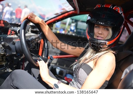 racing woman in sport car