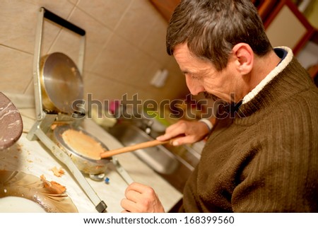 man baking Roll wafers