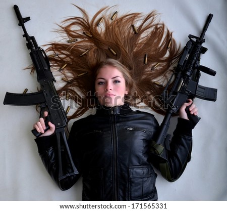 Sexy woman woman with a gun