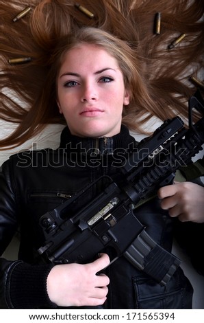 Sexy woman woman with a gun
