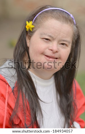 woman with down syndrome with flower