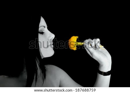 happy beautiful woman blowing dandelion