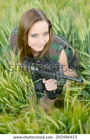 Sexy woman holding up her weapon