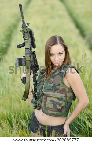 sexy woman holding up her weapon