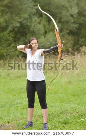 Young woman training with the bow