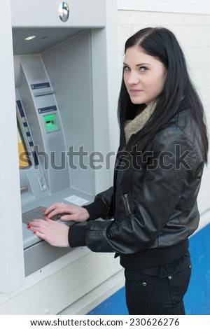 Portrait of a young girl with a cash card