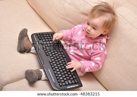 baby hand on pc keyboard