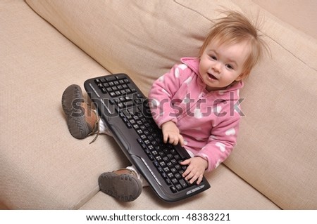 baby hand on pc keyboard