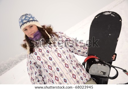woman on snowboard
