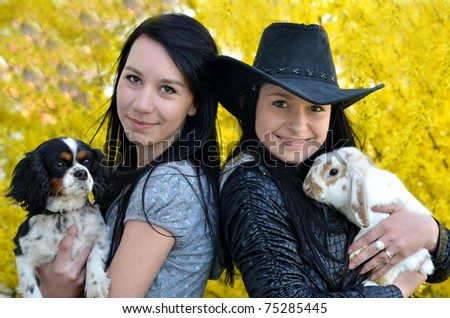 women with dog and rabbit
