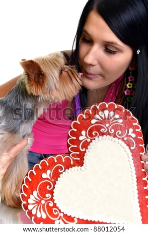 woman with puppy and gingerbread heart isolated on white background