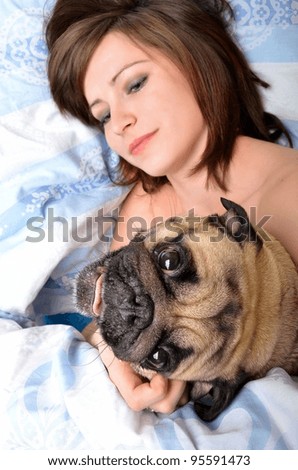 Woman and her dog  in the bed