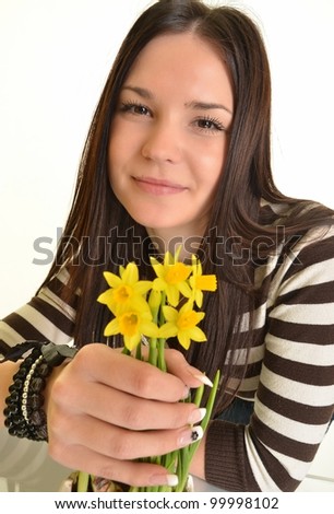Beautiful young woman with narcissus