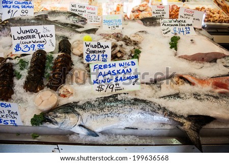 SEATTLE - MAY 10: A fresh wild Alaskan king salmon is displayed at City Fish Co. at Pike Place Market in Seattle on May 10, 2014. City Fish Co. opened in 1917.