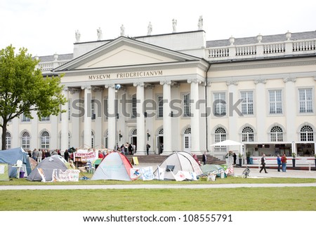 KASSEL, GERMANY -JUNE 23: people visit the Fridericianum on June 23, 2012 in Kassel. This is the main venue of documenta - one of the most important exhibitions for contemporary art.