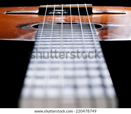 Guitar fingerboard and close up frets, limited focus.