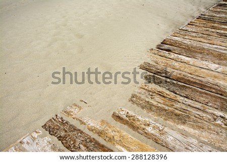 Wooden floor with sand diagonally composed.