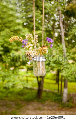 vintage bouquet of dried flowers in a jar