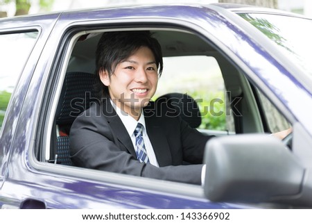 young businessman in a car