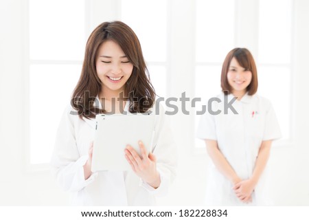 Young attractive asian nurse and doctor