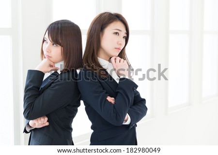young attractive asian businesswomen who is troubled