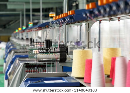 Textile industry with knitting machines in factory
