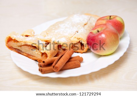 Sweet apple pie with cinnamon and red apples