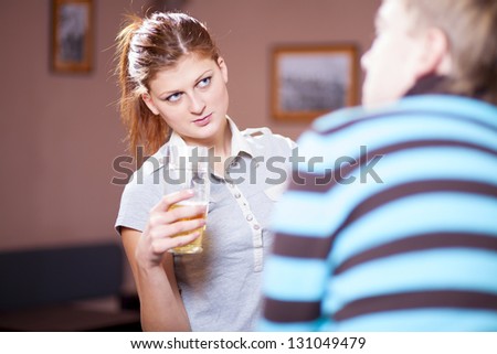 young adult couple dining out in restaurant and talking