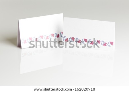 Blank place card for wedding table placing on gray background