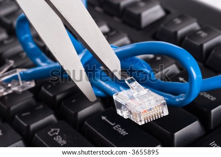 Network cable tied in a nott and scissors cutting the cable