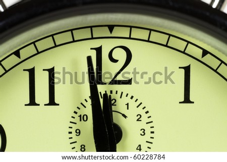 Tight shot of clock centered on twelve o\'clock