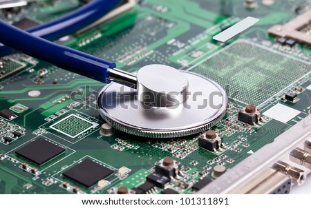 Laptop green motherboard with stetoscope on it