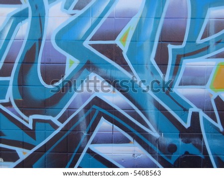 close-up of graffiti and tags on a wall