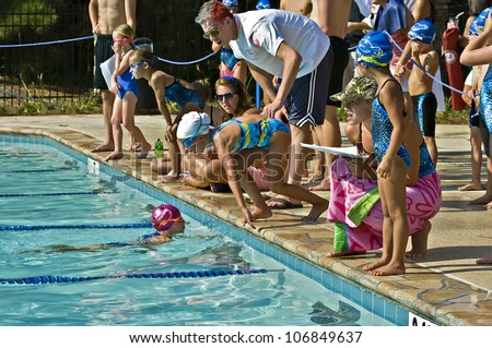 ATLANTA, GA - JUNE 28 : Unidentified young swimmers during the Lake Forest Lightening vs. St. Marlo swim meet relay competition on  June 28, 2012, Lake Forest was the winner.