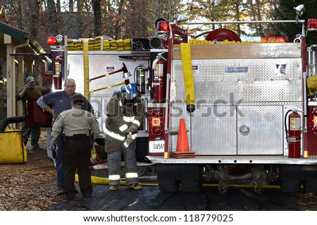 TIGER, GA, USA - NOV. 9: A group of firemen getting ready to fight a house fire. November 9, 2012, on Lake Burton.