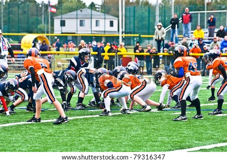 CUMMING, GA - OCT 17: Scrimmage line of a football game. A team of 7-9 year old boys October 17, 2009 in Cumming GA.  The Broncos vs The Eagles.