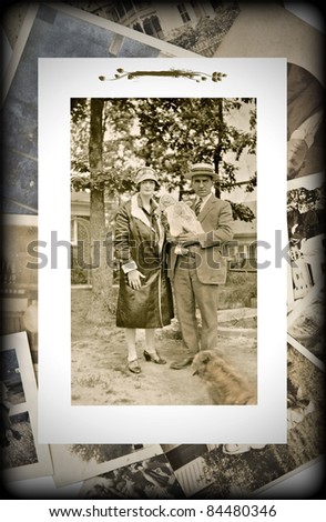 An original vintage photograph of a couple with a baby on a background of old pictures.