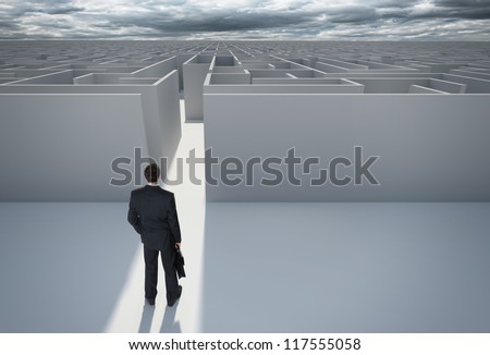Businessman standing in front of the entrance to the maze. Make a decision. Achieving the goal. Without the sign \