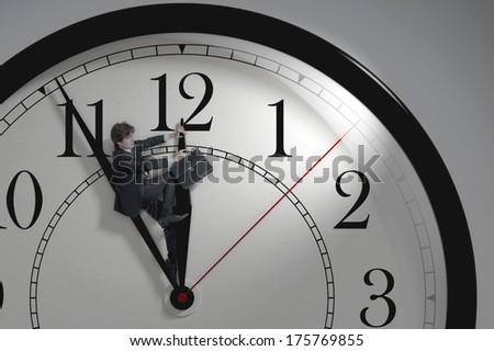 Businessman trying to stop time. Time Management. Cure for old age. Deadline.Time pressure