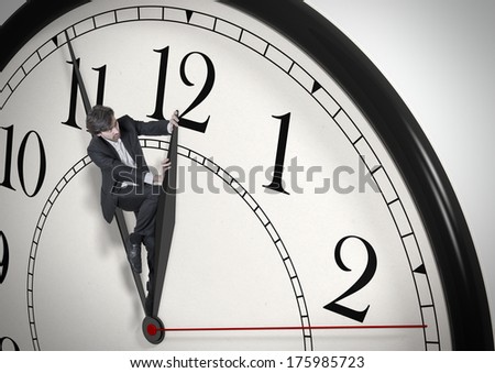 Deadline. Businessman trying to stop time. Time Management. Time pressure. Cure for old age. Perspective view.