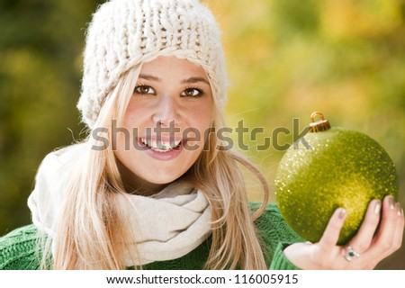 Young woman is looking forward to christmas