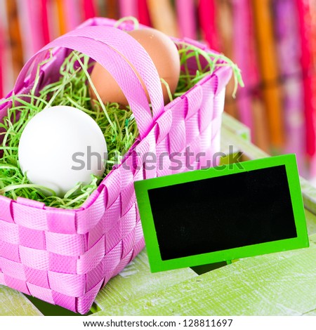 Easter eggs in a pink basket