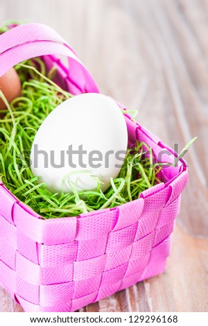 Easter eggs in a pink basket