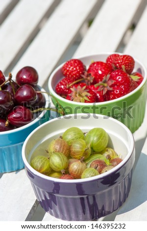 Fresh fruits in colorful fruit bowls