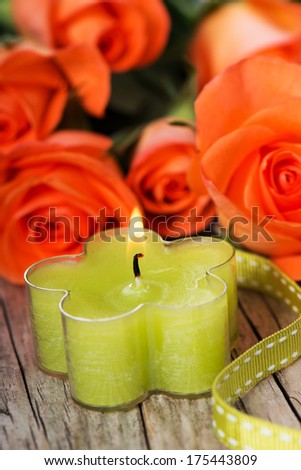 Candle with roses